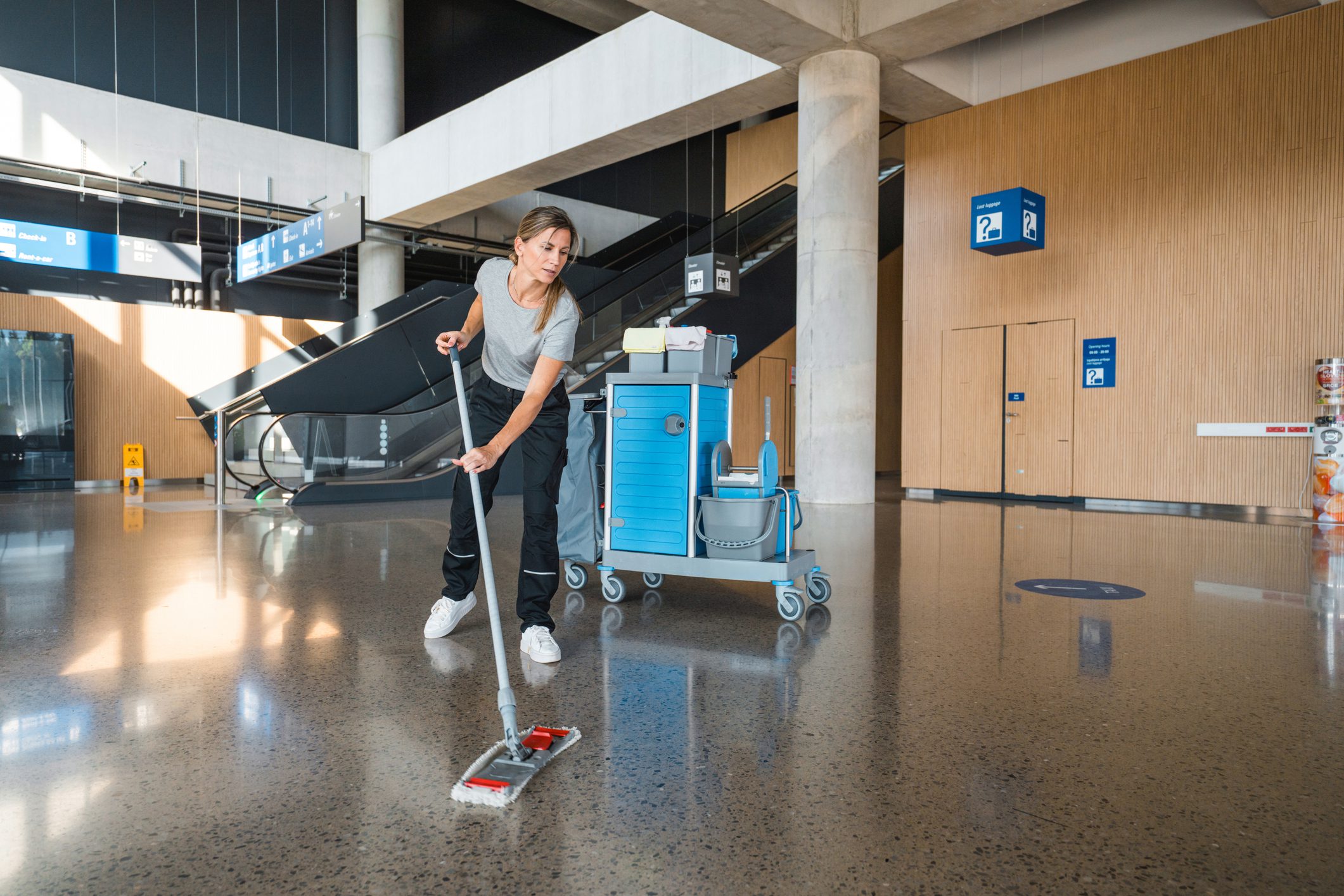 Cleaning staff working in spacious terminal