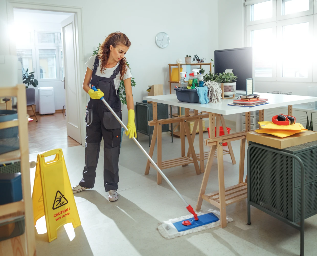 Cleaning staff mopping workspace