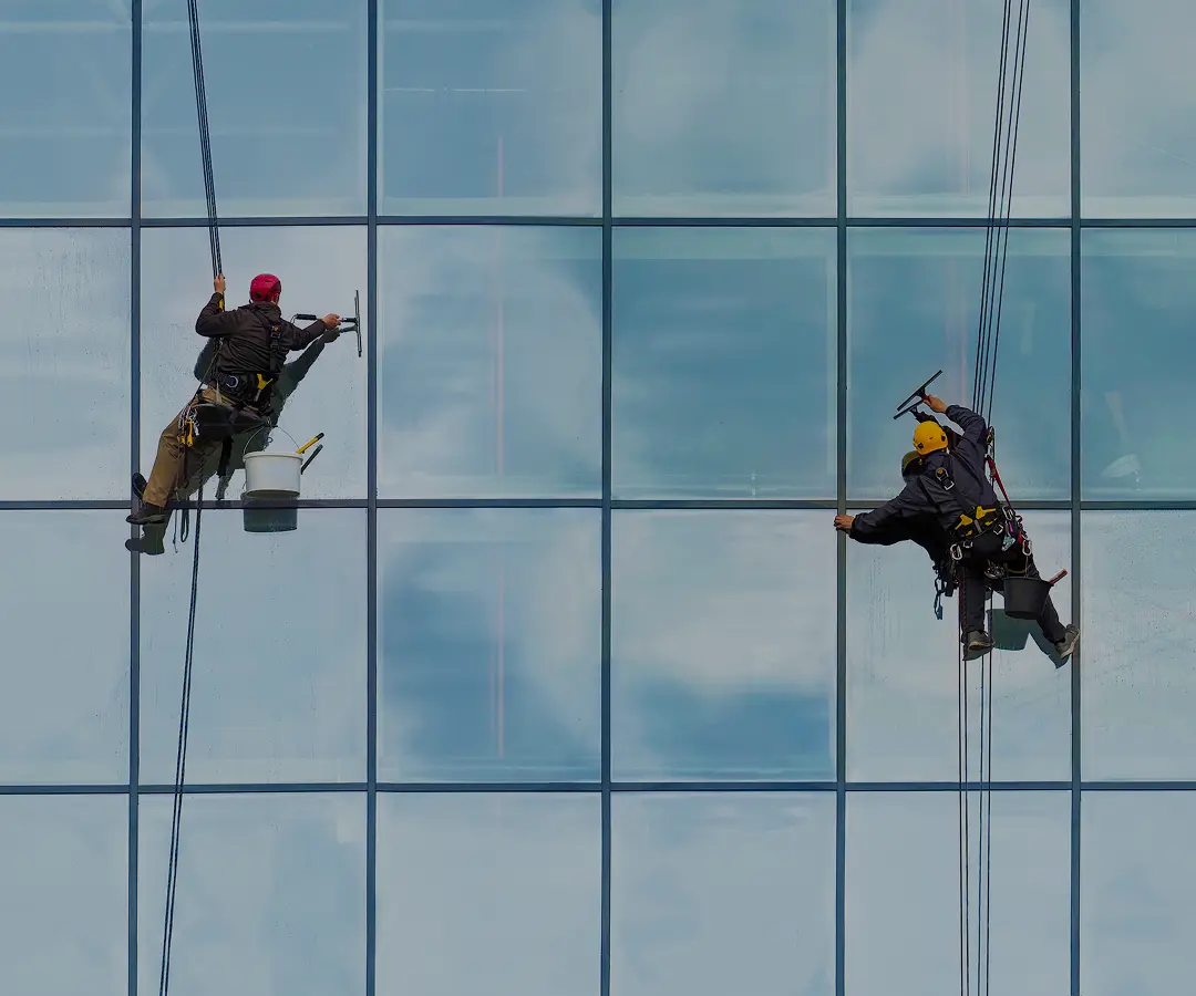 Workers cleaning skyscraper windows