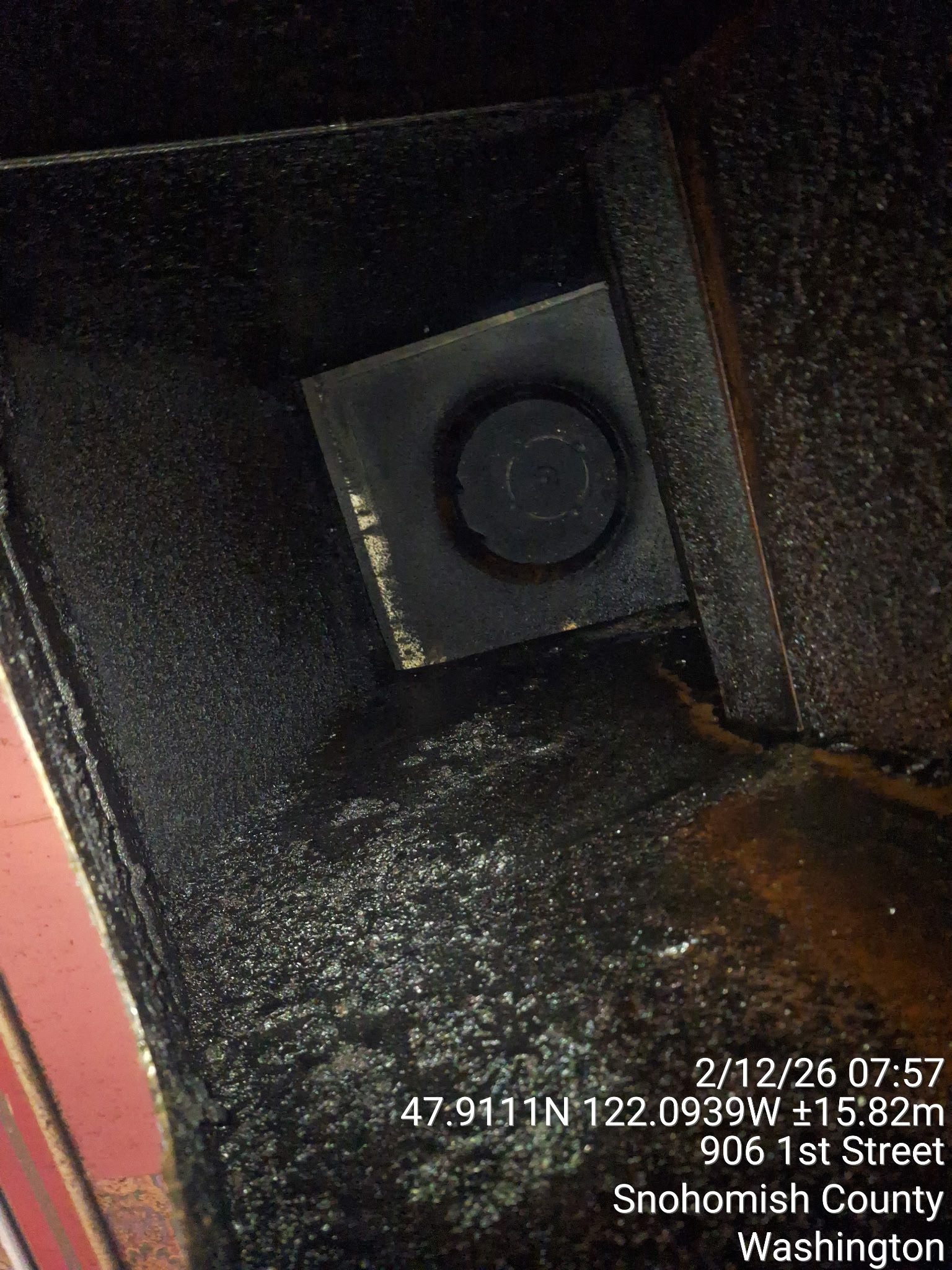 Dimly lit old elevator shaft with a rusty, worn interior.