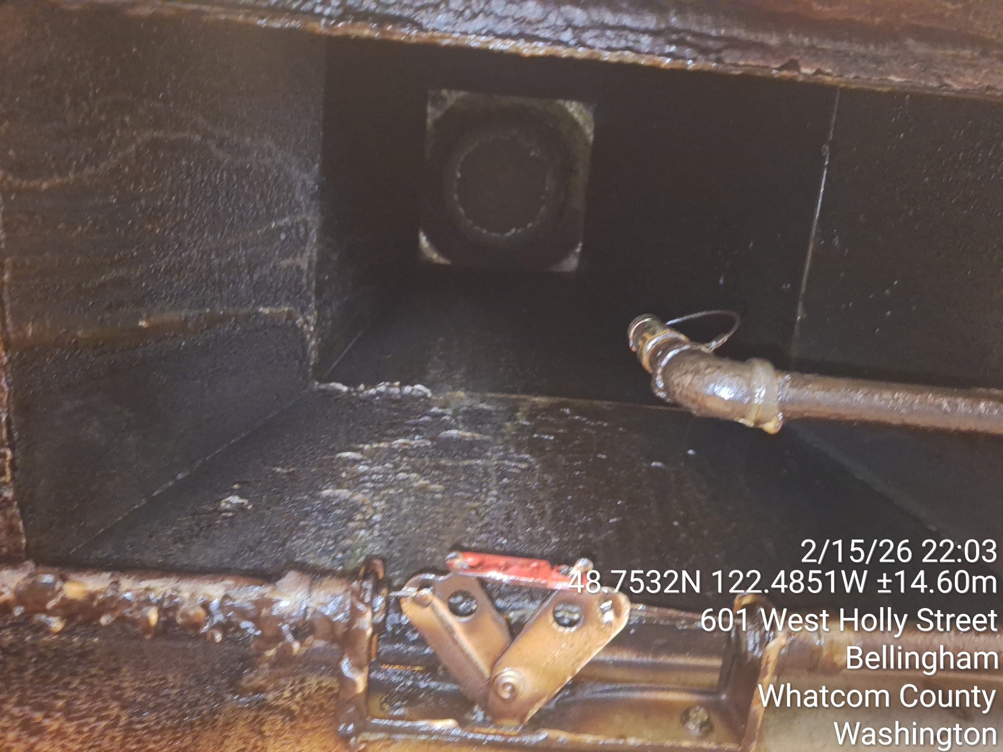 Inside view of a mechanical pipe with a valve and flange.