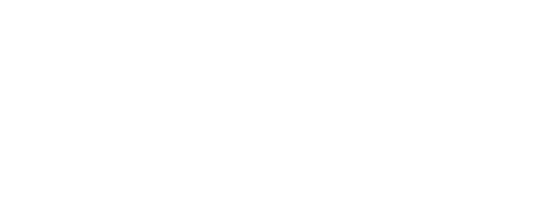 A black cat with bright yellow eyes peeking through metal bars.